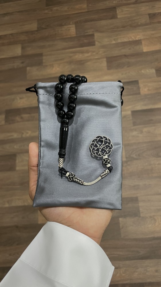 A holder for prayer beads