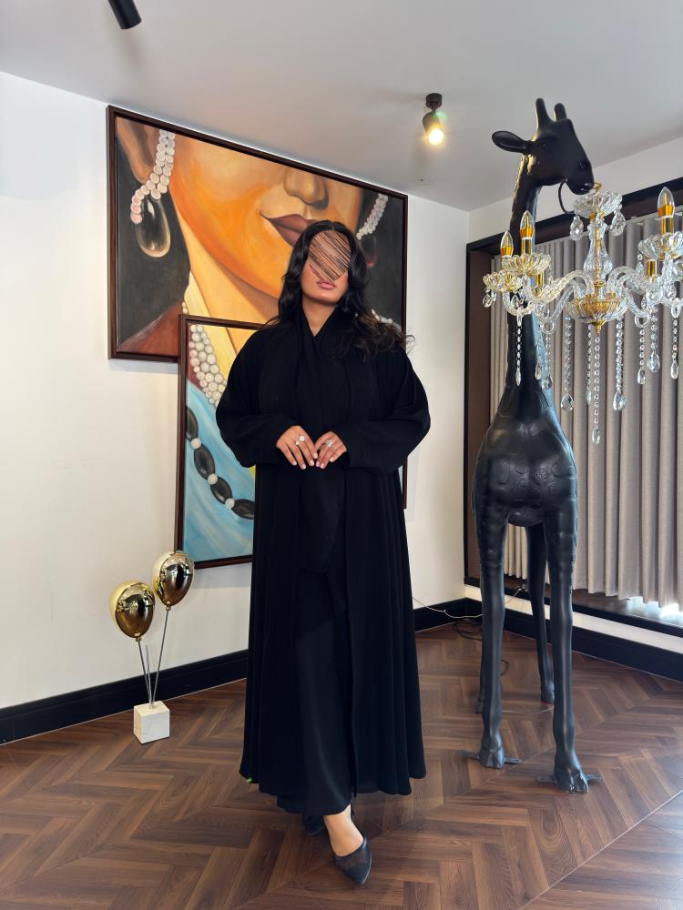 Double abaya with wide sleeves made of Indonesian ceramic fabric with precise stitching for fit
