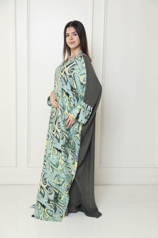 A green abaya with a modern artistic pattern, elegant