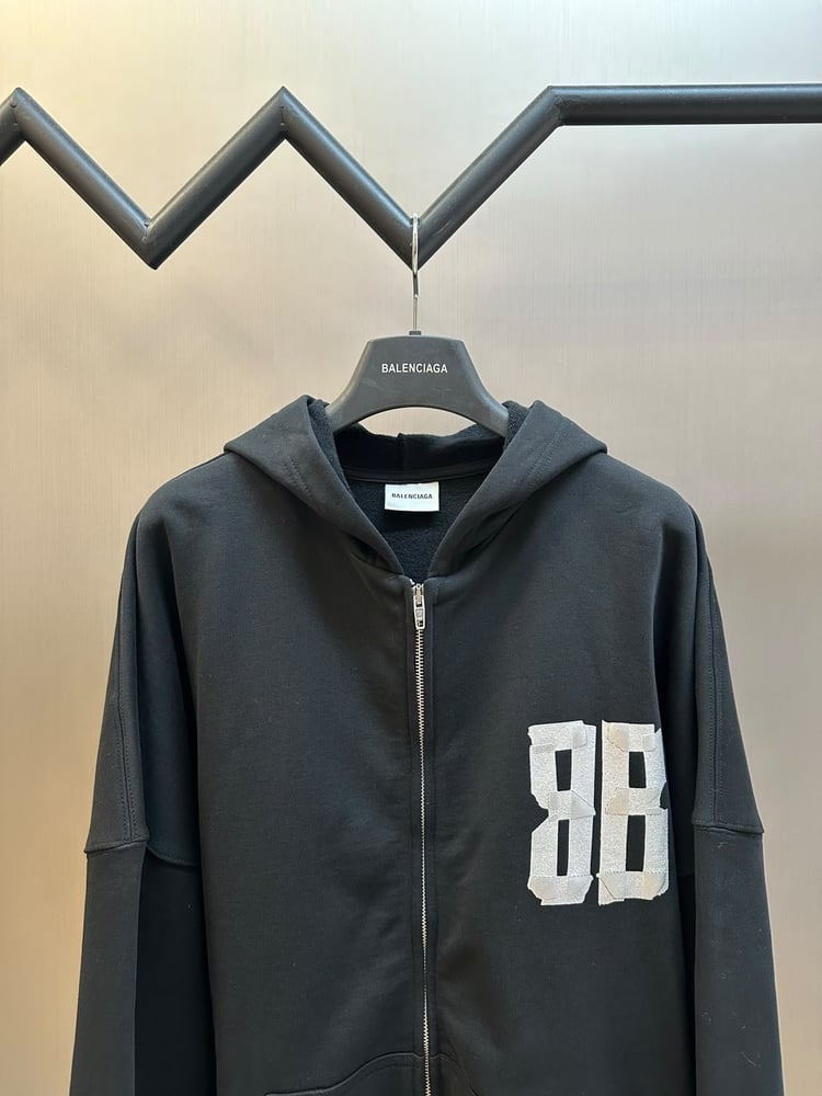 هودي بالنسياغا بتصميم الشريط اللاصق (Balenciaga Tape Type Zip-Up Hoodie)