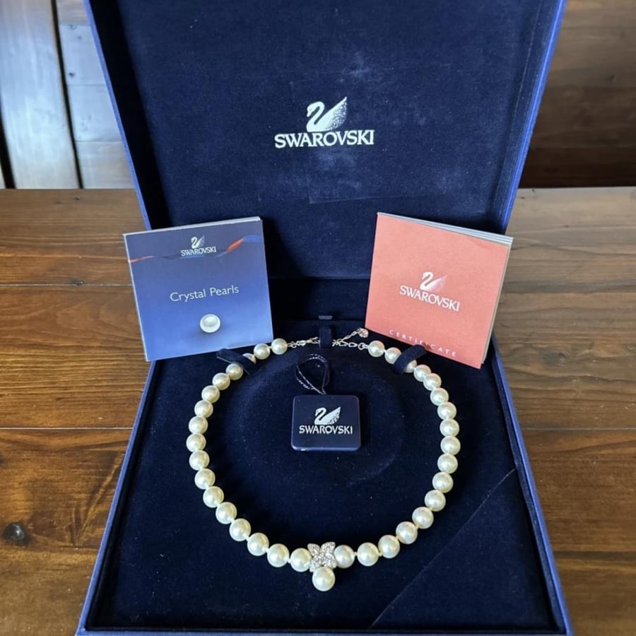 The pearl necklace, Swarovski brand, from the 1990s.