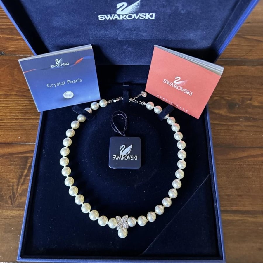 The pearl necklace, Swarovski brand, from the 1990s.
