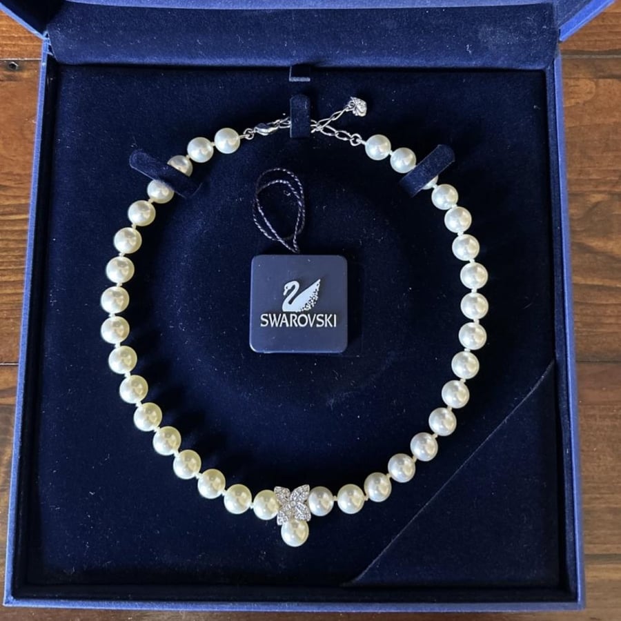 The pearl necklace, Swarovski brand, from the 1990s.