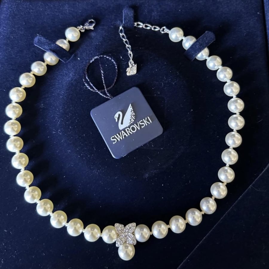 The pearl necklace, Swarovski brand, from the 1990s.