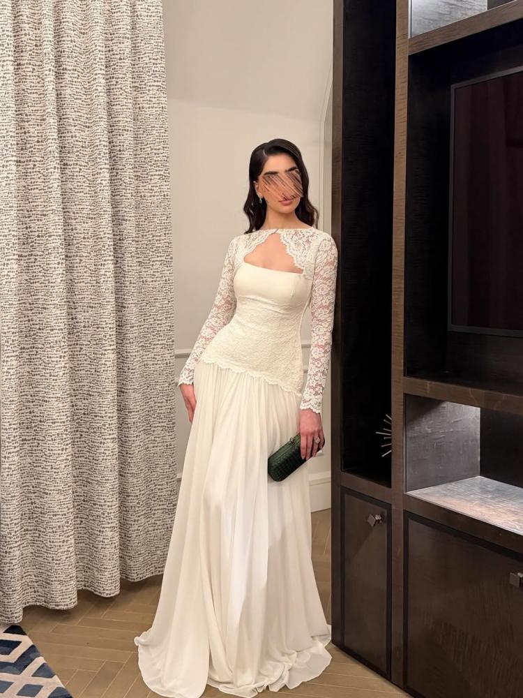 White lace evening dress embroidered with elegance