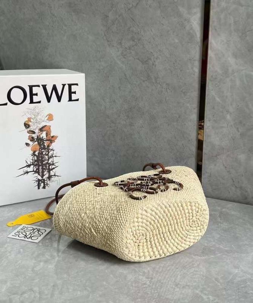 small Anagram Basket bag in it’s a palm and calfskins Tan