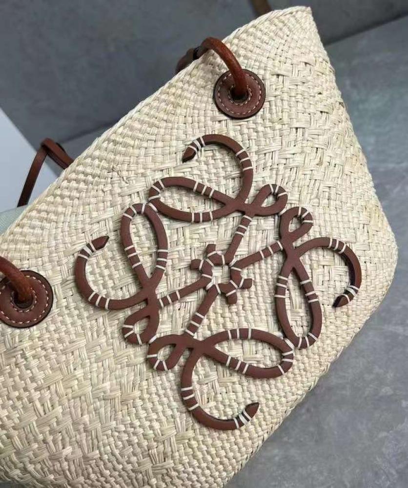 small Anagram Basket bag in it’s a palm and calfskins Tan