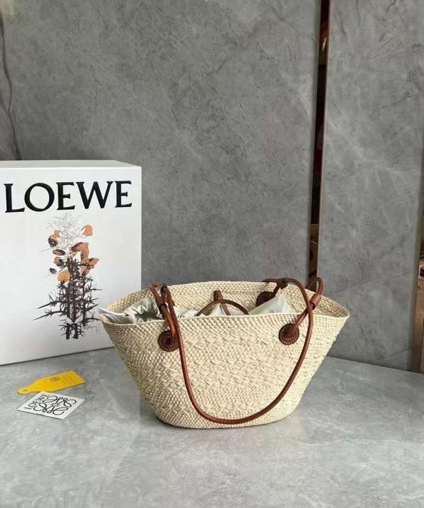small Anagram Basket bag in it’s a palm and calfskins Tan