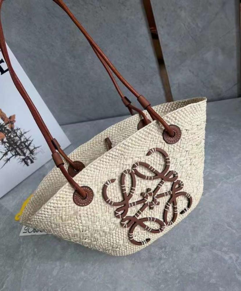 small Anagram Basket bag in it’s a palm and calfskins Tan
