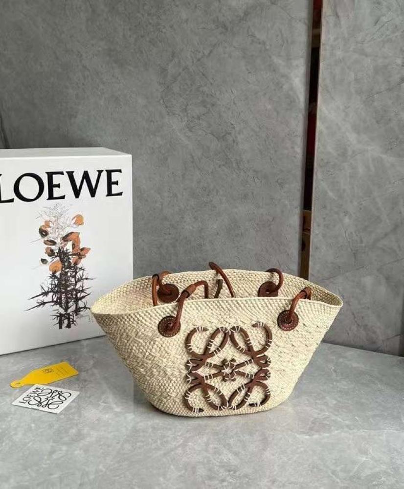 small Anagram Basket bag in it’s a palm and calfskins Tan