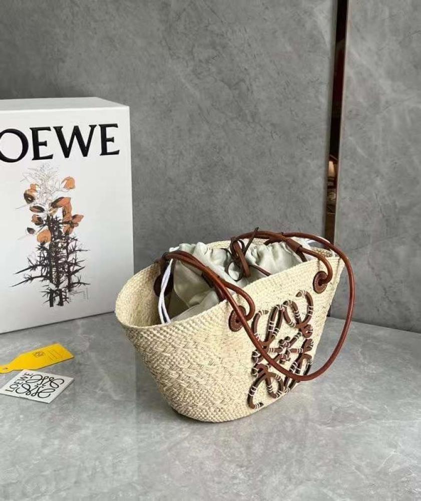 small Anagram Basket bag in it’s a palm and calfskins Tan