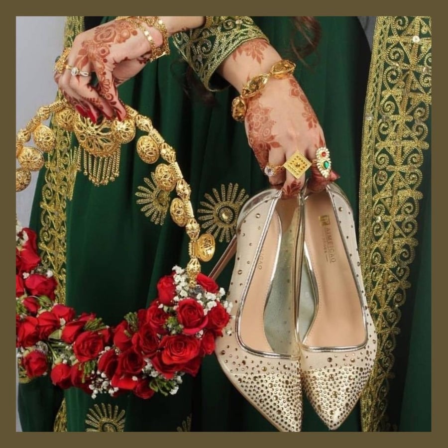 She held him, a bride only for the night of the Henna.