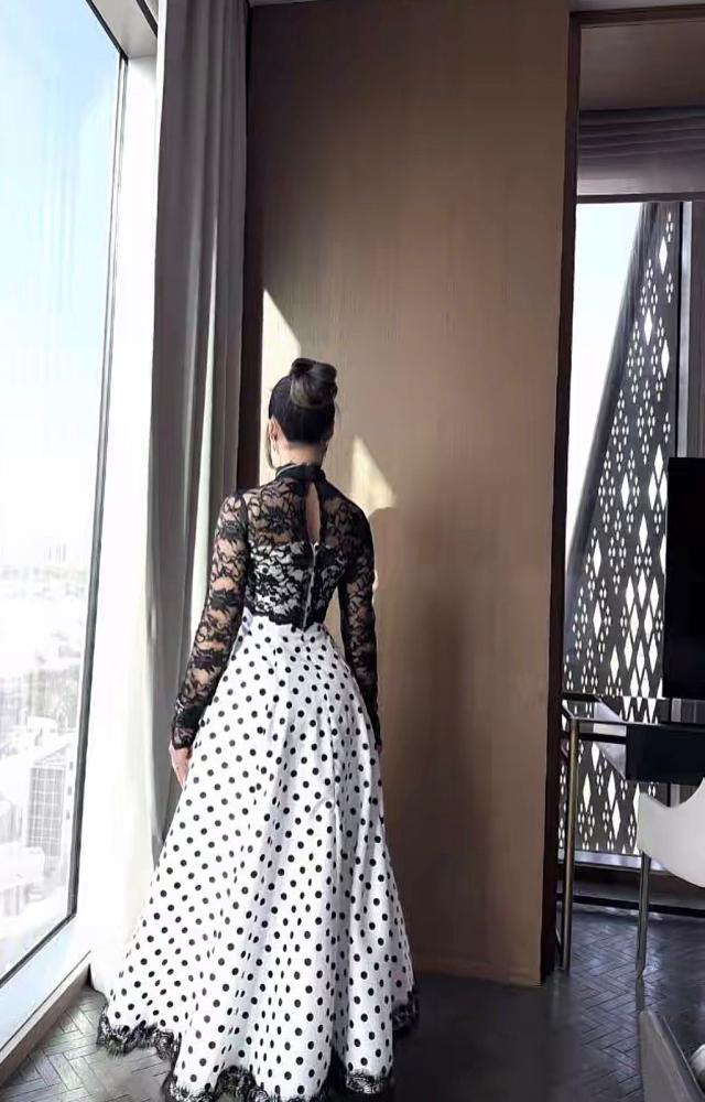 White evening dress with black dots and a black lace layer