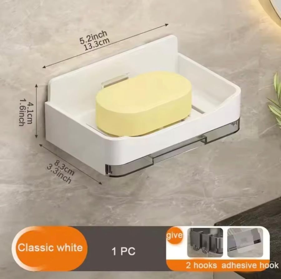 طبق صابون جداري لاصق بتصميم عصري داكن يثبت بدون حفر ويصرف الماء بشكل تلقائي.