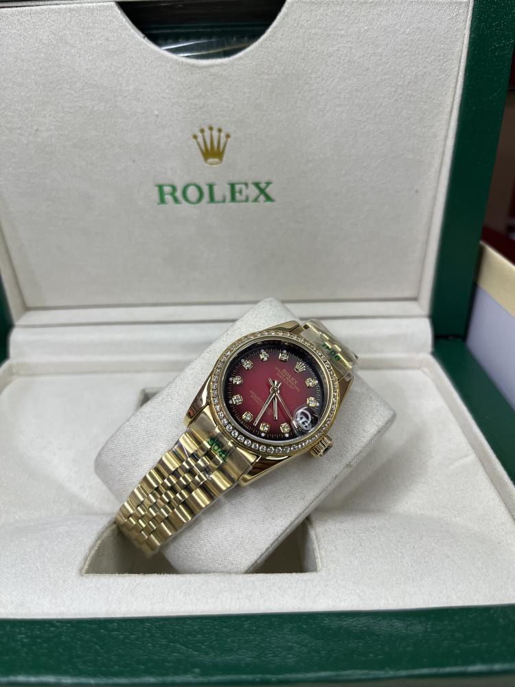 Rolex Datejust women's size 31 mm - yellow gold strap - red dial
