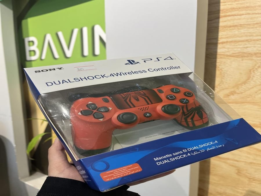 A hand controls PlayStation