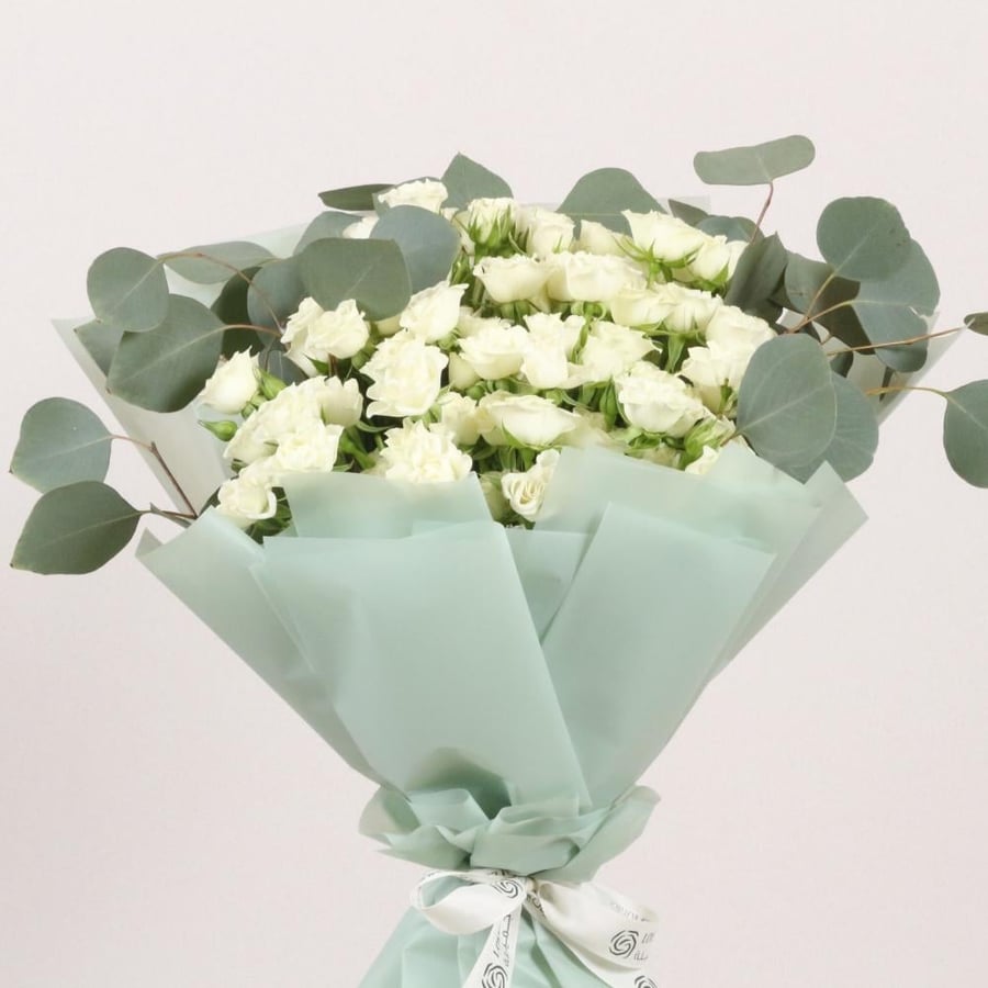 A bouquet of white roses with green veins