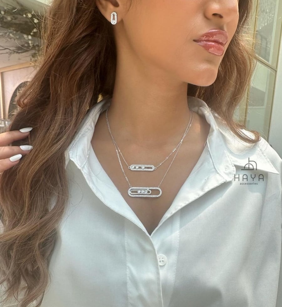 A set (necklace + earrings) plated and decorated with zircon