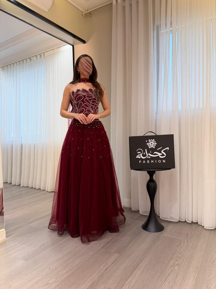 Evening dress with embroidered traditional fabric