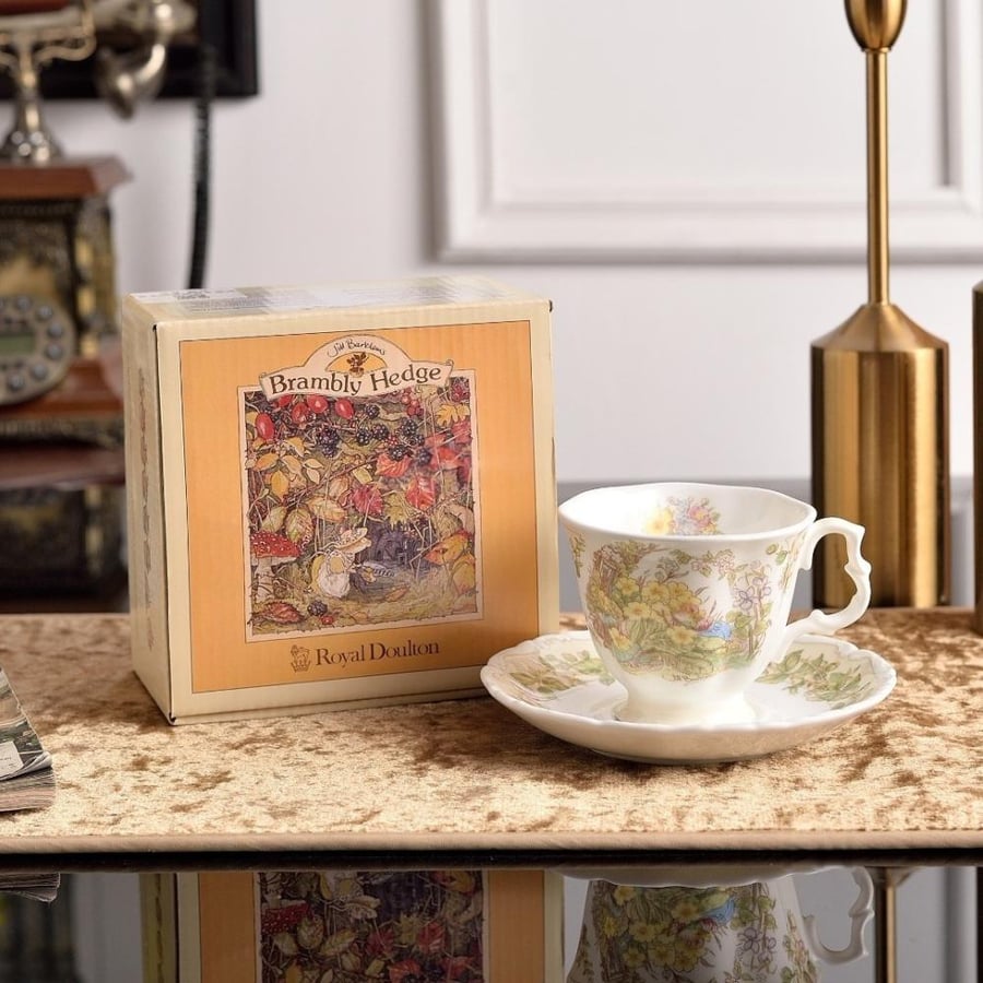 A luxurious coffee cup with a decorated serving plate
