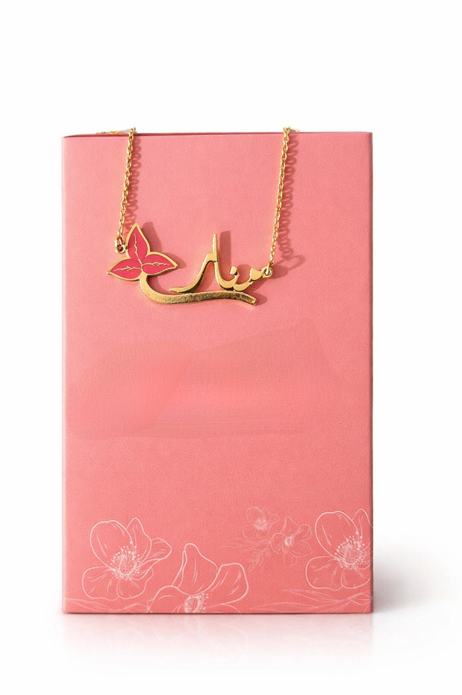 A pink necklace with a name and a distinctive design