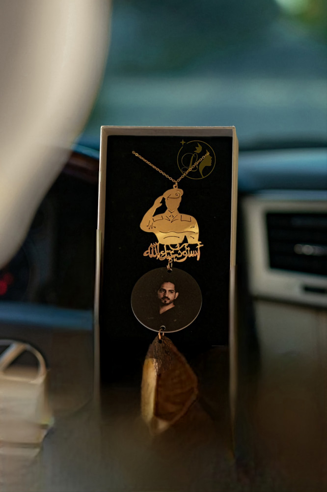 Car pendant with military image and piece of oud