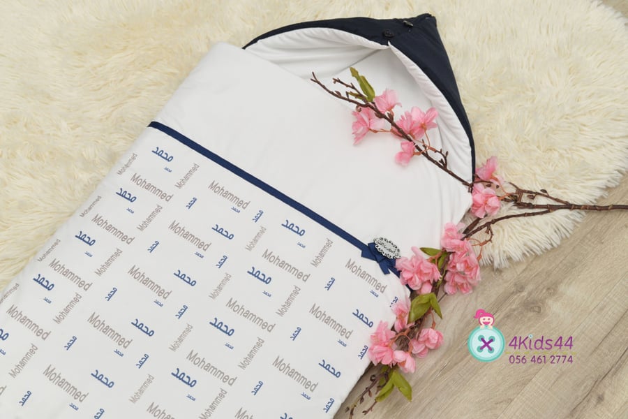 A bedspread with a roll and a hat