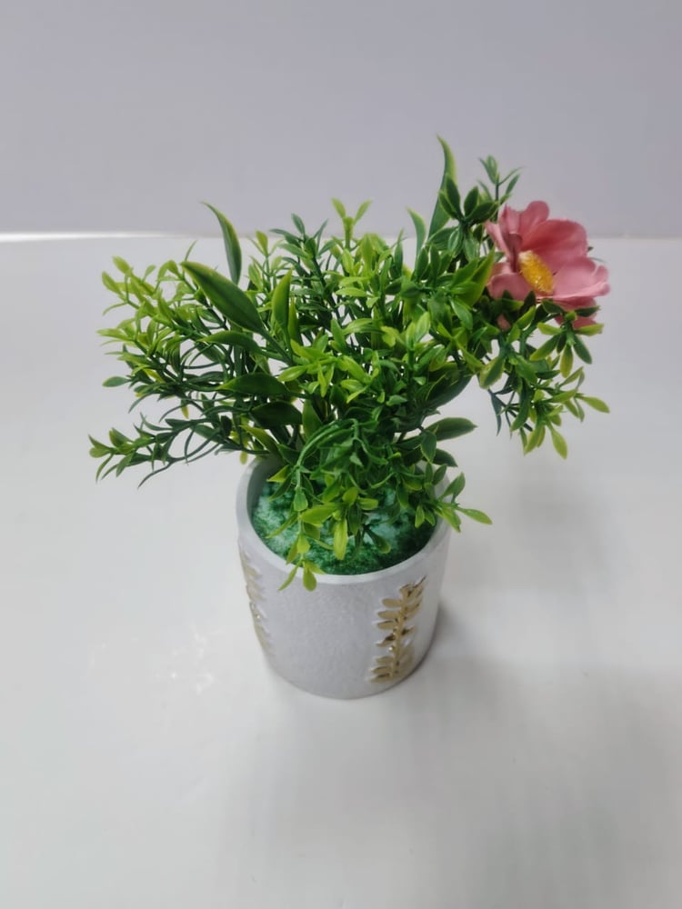 Small Faux Flower and Green Plant in Decorative White Pot زهرة صناعية صغيرة ونبات أخضر في وعاء أبيض مزخرف