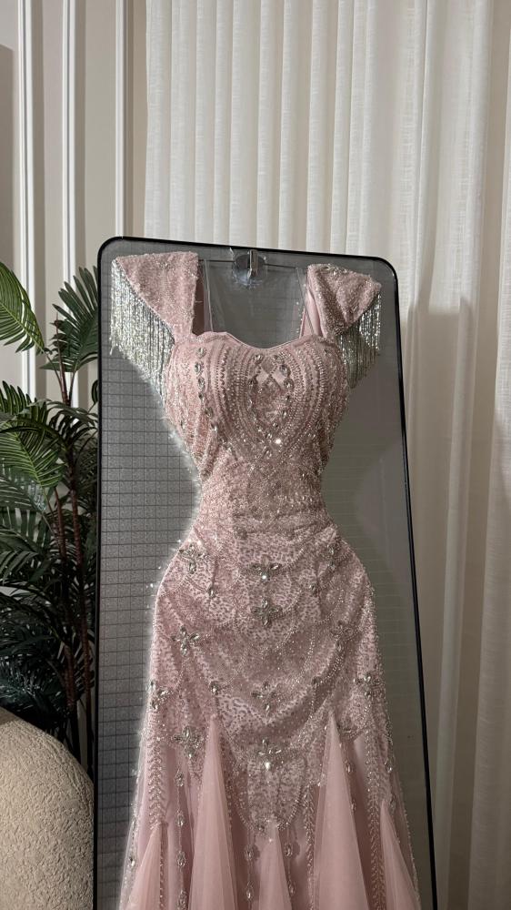 Dress with padded design, beads, and chains