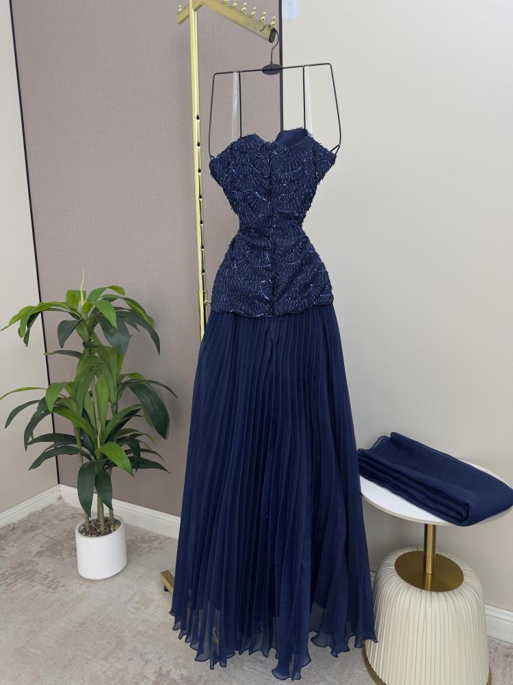 Dress decorated with beads and rhinestones