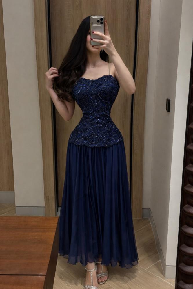 Dress decorated with beads and rhinestones