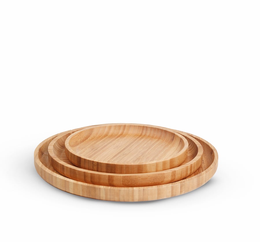 A set of 3 round serving trays made of luxurious natural wood