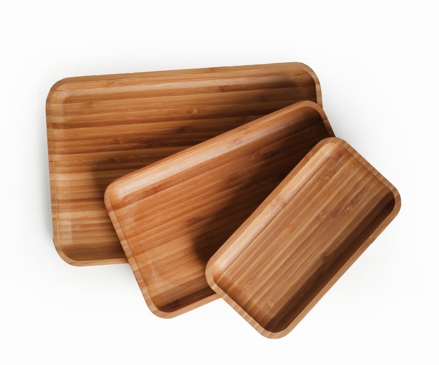 A set of 3 square natural fine wood serving trays