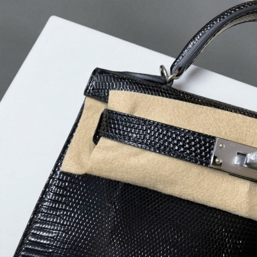 Hermès Kelly 19 in shiny black lizard leather with palladium hardware