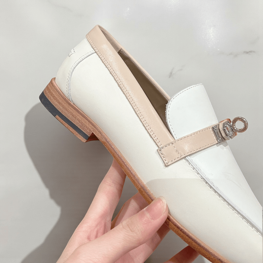 Ivory Hermès Kelly loafers with metallic buckle
