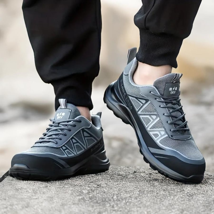 Gray safety shoe reinforced with hard protection plates