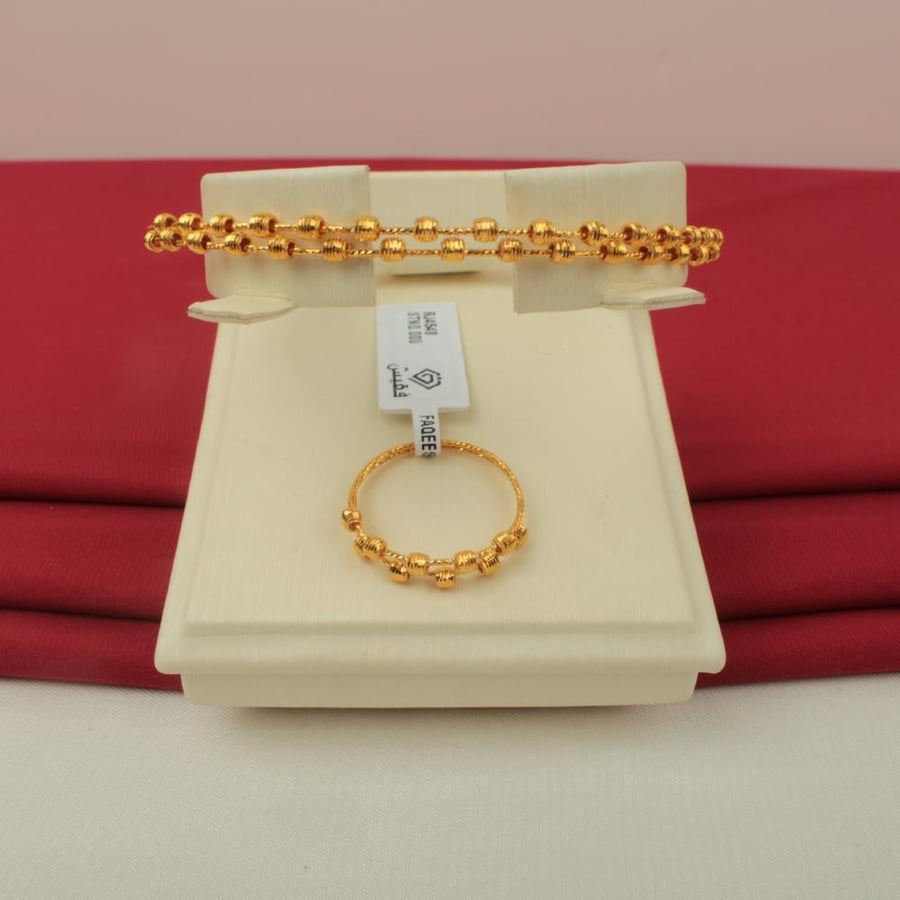 Gold bracelet with its 21-karat ring