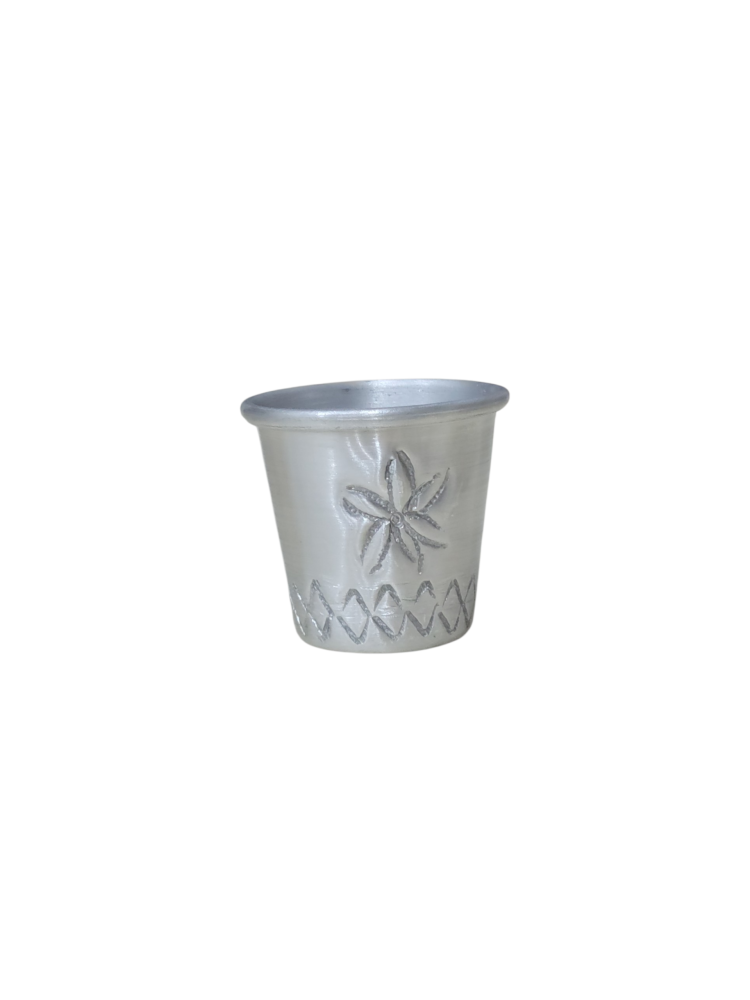 A measuring cup engraved Aden