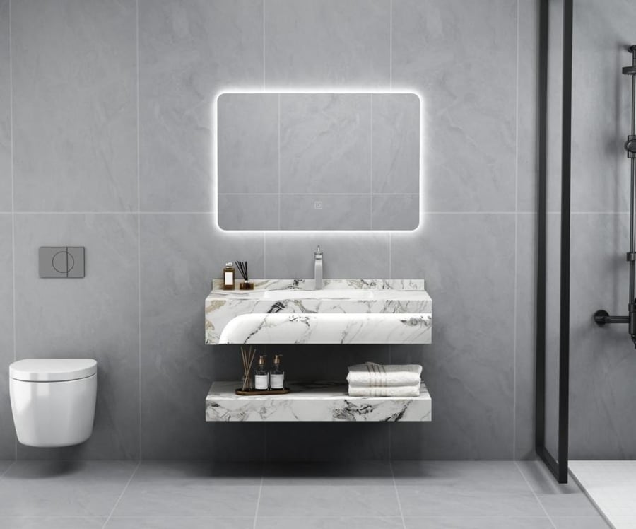 White marble sinks with gold veining, front lighting, one basin, and two basins in various sizes