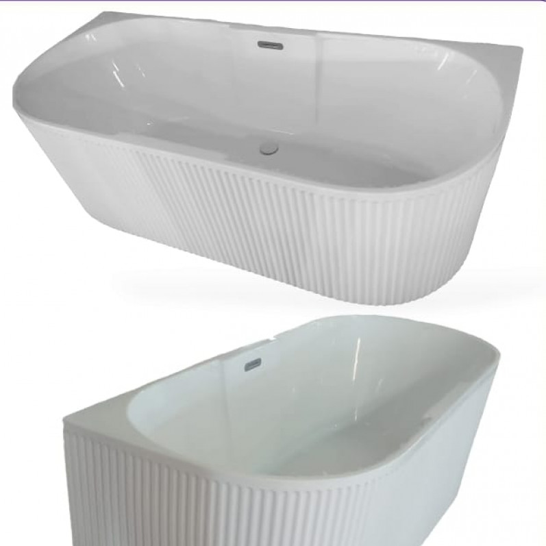 A classic white bathtub above the tiles