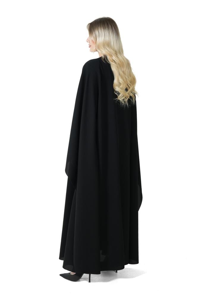 A black abaya with a distinctive cut and elegant embroidery.