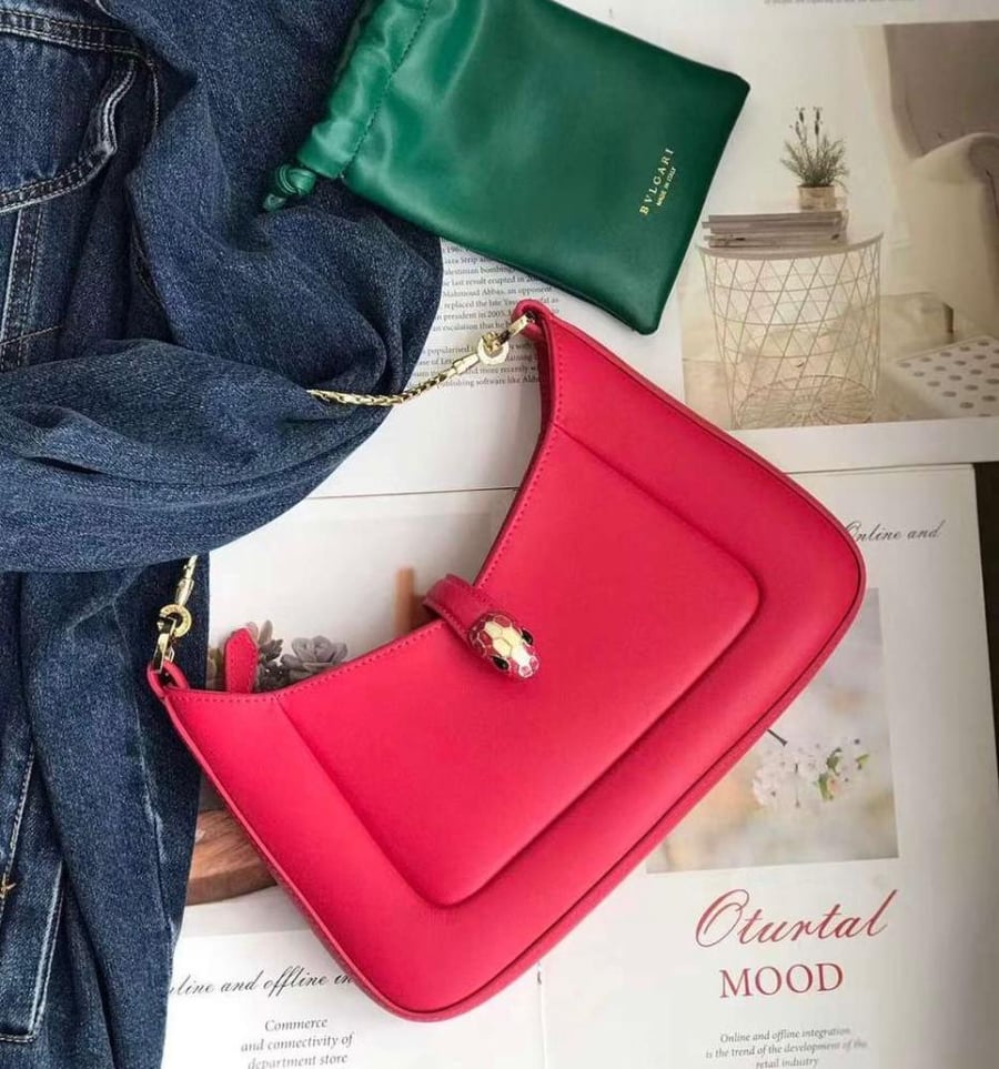 Bulgari women's red bag with elegant chain holder