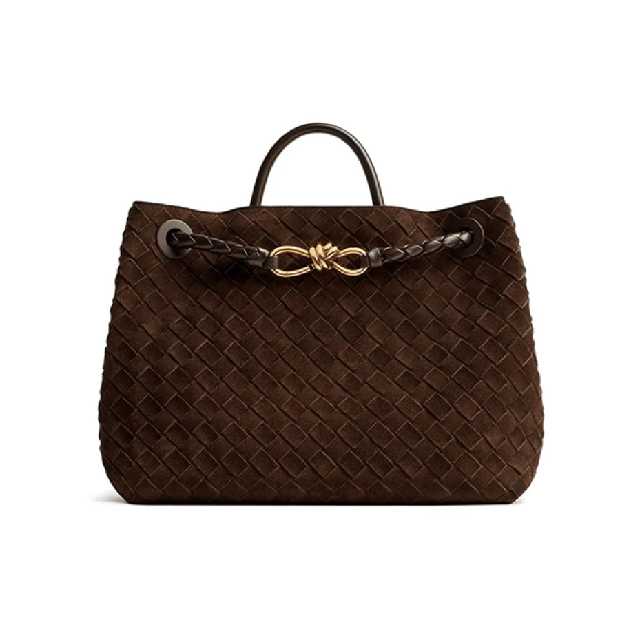 Bottega Veneta spacious handbag in elegant brown color with a handle and gold metal