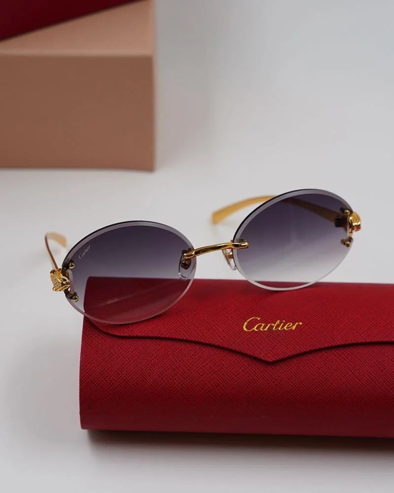 Cartier luxury oval rimless sunglasses in transparent blue