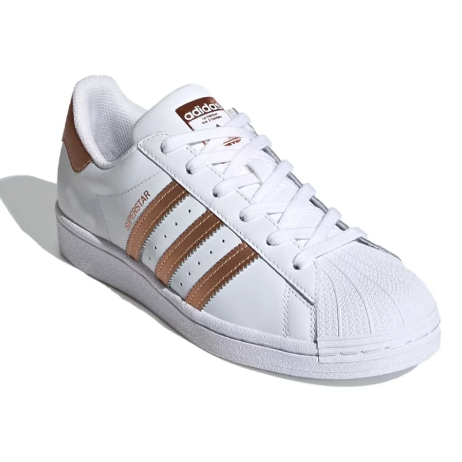 حذاء للجنسين adidas سوبر ستار ابيض بخطوط ذهبي