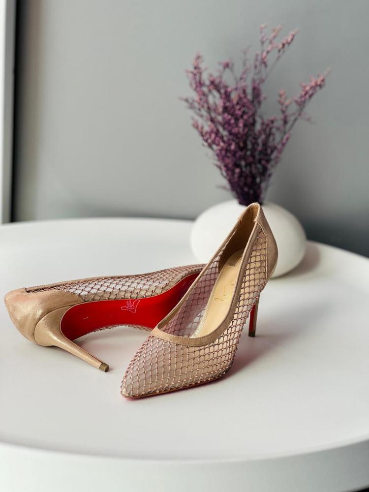 Christian Louboutin women's high-heeled sandals in beige, elegant, and decorated with rhinestones.