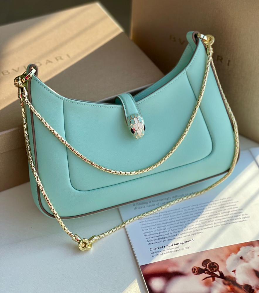 Bulgari women's bag, elegant blue color, with a gold chain holder