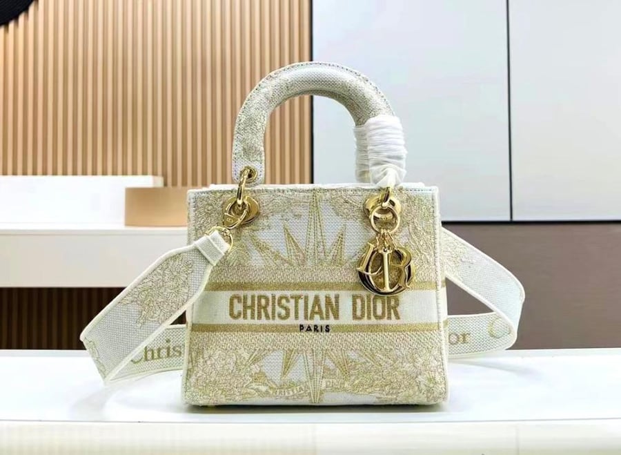 Dior lady D-lite denim bag with a distinctive gold print