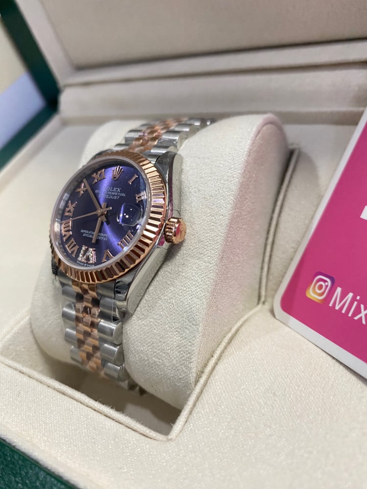 Rolex 31 mm purple dial