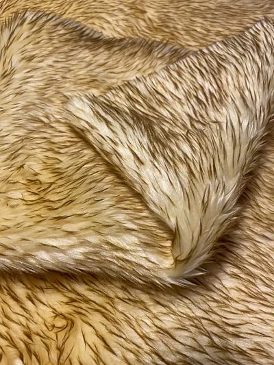 Fur for decoration in saffron color with black stripes